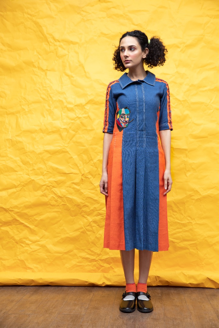 Denim dress with lots of detailing. charlie motif